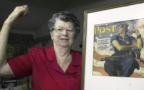 FILE - In this May 22, 2002 file photo, Mary Doyle Keefe poses at her home in Nashua, N.H., with the May 29, 1943, cover of the Saturday Evening Post for which she had modeled as "Rosie the Riveter" in a Norman Rockwell painting. Keefe died Tuesday, April 21, 2015, in Simsbury, Conn., after a brief illness. She was 92. (AP Photo/Jim Cole, File)